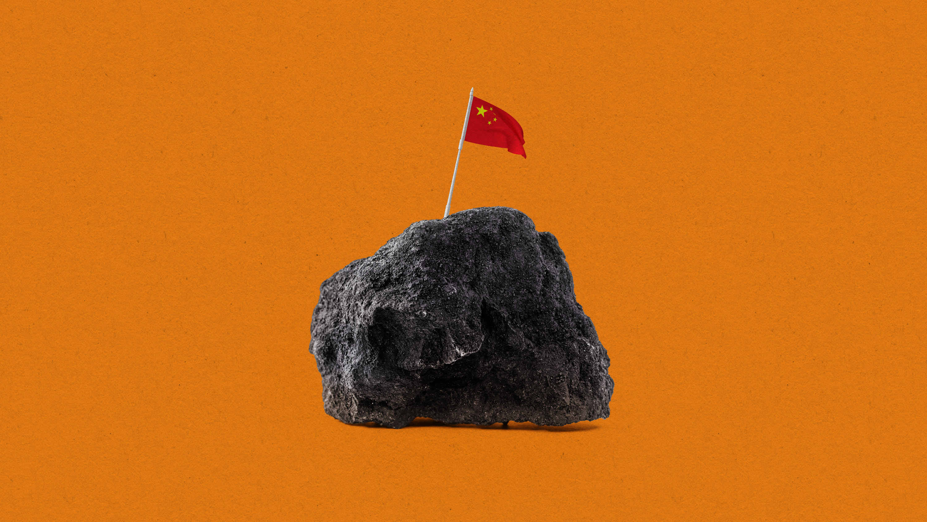 a tiny Chinese flag claiming a lump of graphite