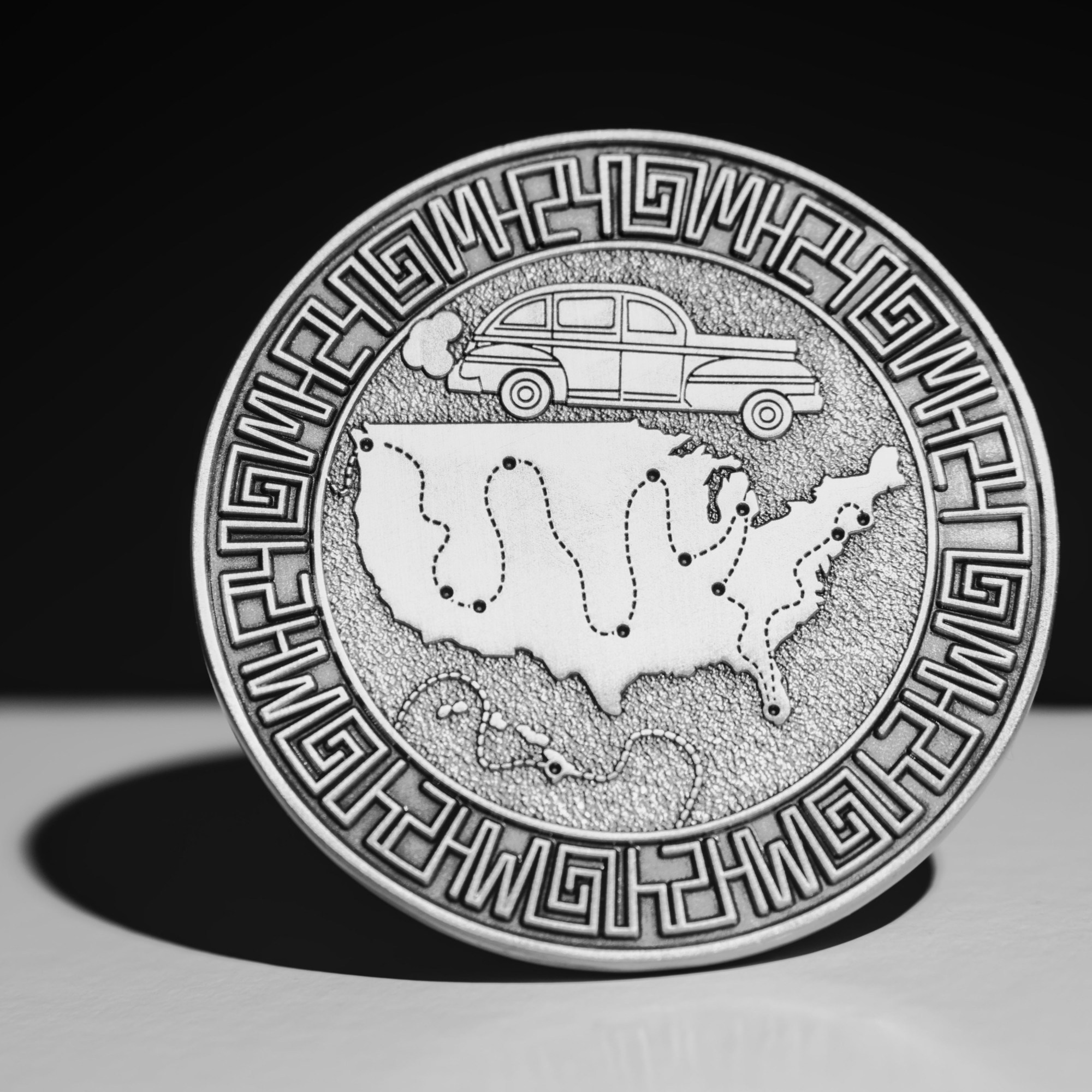 a custom coin with a map of the United States